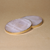 Rose quartz remains with a gold-plated edge